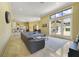 Open-concept living area with tile flooring, ample natural light, and modern furnishings at 12663 Hawkstone Dr, Windermere, FL 34786