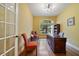 Bright office with hardwood floors, a large desk, and a window with a view at 12663 Hawkstone Dr, Windermere, FL 34786
