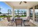 Covered patio with a table and chairs overlooking the lake at 12663 Hawkstone Dr, Windermere, FL 34786
