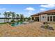 Backyard pool overlooking the lake and featuring a brick paver patio, and covered outdoor seating at 12663 Hawkstone Dr, Windermere, FL 34786
