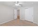 Bedroom features a closet, ceiling fan and wood-look floors at 13519 Bicton Ln, Windermere, FL 34786