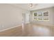 Inviting bedroom offering wood floors, a ceiling fan, and access to a private outdoor balcony at 13519 Bicton Ln, Windermere, FL 34786