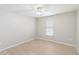 Bedroom with a ceiling fan, window, and wood-look flooring at 13519 Bicton Ln, Windermere, FL 34786