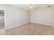 Bright bedroom features wood-look floors and neutral paint at 13519 Bicton Ln, Windermere, FL 34786