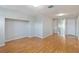 Spacious bonus room with wood floors, neutral walls, and a large opening for entertainment center at 13519 Bicton Ln, Windermere, FL 34786