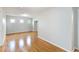 Bright bonus room with light-colored walls, wood floors and natural lighting from the three windows at 13519 Bicton Ln, Windermere, FL 34786
