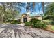 Charming community clubhouse surrounded by lush landscaping and mature trees at 13519 Bicton Ln, Windermere, FL 34786