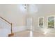 Spacious foyer featuring tile flooring, a staircase, and lots of light at 13519 Bicton Ln, Windermere, FL 34786