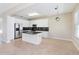 Kitchen featuring granite counters, stainless steel appliances and white cabinetry at 13519 Bicton Ln, Windermere, FL 34786