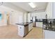 Kitchen with granite countertops, stainless steel appliances, and a central island at 13519 Bicton Ln, Windermere, FL 34786