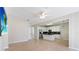 Open concept kitchen and living area with tile floors and stainless steel appliances at 13519 Bicton Ln, Windermere, FL 34786