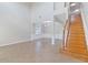Open-concept living room with staircase and dining area at 13519 Bicton Ln, Windermere, FL 34786
