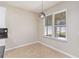 Breakfast nook filled with natural light from windows overlooking the backyard at 13519 Bicton Ln, Windermere, FL 34786