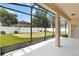 Covered patio overlooking a putting green in backyard at 13519 Bicton Ln, Windermere, FL 34786