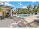 This community pool offers ample space for relaxation and recreation with a covered patio at 13519 Bicton Ln, Windermere, FL 34786