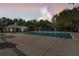 Community pool with ample seating, a covered pavilion, and lush landscaping at 13519 Bicton Ln, Windermere, FL 34786