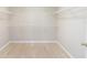 Large walk-in closet featuring a custom shelving system and wood floors providing ample storage space at 13519 Bicton Ln, Windermere, FL 34786