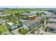 Aerial view of the apartment building, pool, lake, and surrounding area at 13618 Heaney Ave, Orlando, FL 32827