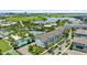 Aerial view of the apartment building, pool, lake, and surrounding area at 13618 Heaney Ave, Orlando, FL 32827