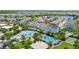 Aerial view of the apartment building, pool, volley ball court, and surrounding area at 13618 Heaney Ave, Orlando, FL 32827
