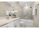 This bathroom features neutral paint, double sinks, a tub, and tiled shower at 13618 Heaney Ave, Orlando, FL 32827