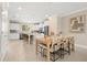 Spacious open-concept kitchen and dining area featuring modern appliances and stylish decor at 13618 Heaney Ave, Orlando, FL 32827