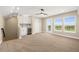 Open-concept living room featuring a dry bar with mini-fridge and an expansive window view at 13618 Heaney Ave, Orlando, FL 32827