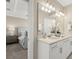 View from the main bathroom to the main bedroom, highlighting the double vanity at 13618 Heaney Ave, Orlando, FL 32827