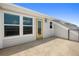 Outdoor patio with a yellow door, white trim, and view of the rooftops at 13618 Heaney Ave, Orlando, FL 32827
