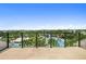 Scenic view from balcony showcasing a pool and community amenities under a bright blue sky at 13618 Heaney Ave, Orlando, FL 32827
