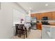 Bright kitchen with stainless steel appliances, wood cabinets, and breakfast table at 13768 Bluebird Pond Rd, Windermere, FL 34786