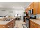 Kitchen features updated stainless steel appliances and a view into the living area at 13768 Bluebird Pond Rd, Windermere, FL 34786