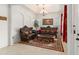 Well-lit living room featuring arched doorways, tile floors, and comfortable seating at 13768 Bluebird Pond Rd, Windermere, FL 34786