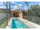 Enjoy your private pool surrounded by a screen enclosure and a white fence at 13768 Bluebird Pond Rd, Windermere, FL 34786