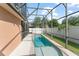 A screened-in pool with an expansive deck offers backyard relaxation at 13768 Bluebird Pond Rd, Windermere, FL 34786