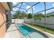 A screened-in pool with an expansive deck offers backyard relaxation at 13768 Bluebird Pond Rd, Windermere, FL 34786