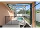 Private pool area enclosed with a screen, safety fence, and patio furniture at 13768 Bluebird Pond Rd, Windermere, FL 34786