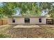 Exterior view features a patio with backyard, sliding glass doors, and plenty of natural light at 14565 Lycastle Cir, Orlando, FL 32826