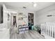Bedroom with crib, storage, and playful decorations at 14565 Lycastle Cir, Orlando, FL 32826