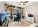 Gaming themed bedroom, featuring built-in shelving and ample natural light at 14565 Lycastle Cir, Orlando, FL 32826