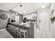 Modern kitchen features a granite countertop island and stainless steel appliances at 14565 Lycastle Cir, Orlando, FL 32826