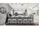 Modern kitchen features a granite countertop island and stainless steel appliances at 14565 Lycastle Cir, Orlando, FL 32826