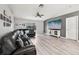 Spacious living room boasts modern flooring and a sliding glass door to the outdoor space at 14565 Lycastle Cir, Orlando, FL 32826