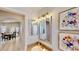 Bathroom features a vanity with decorative artwork and access to the dining room at 14723 Pine Cone Trl, Clermont, FL 34711