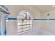 Bright bathroom with a decorative window, tiled walls, and a built-in bench at 14723 Pine Cone Trl, Clermont, FL 34711