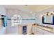 Bathroom features a marble-tiled walk-in shower, a sink with granite counters, and a window at 14723 Pine Cone Trl, Clermont, FL 34711