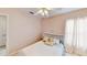 Cozy bedroom with a comfortable bed, soft lighting, and serene atmosphere at 14723 Pine Cone Trl, Clermont, FL 34711