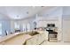 Bright kitchen featuring white cabinetry, stainless steel appliances, and a breakfast bar at 14723 Pine Cone Trl, Clermont, FL 34711