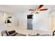 Spacious living room with tile flooring, neutral walls, and an entertainment center at 14723 Pine Cone Trl, Clermont, FL 34711