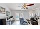 Comfortable living room with a ceiling fan and access to pool at 14723 Pine Cone Trl, Clermont, FL 34711